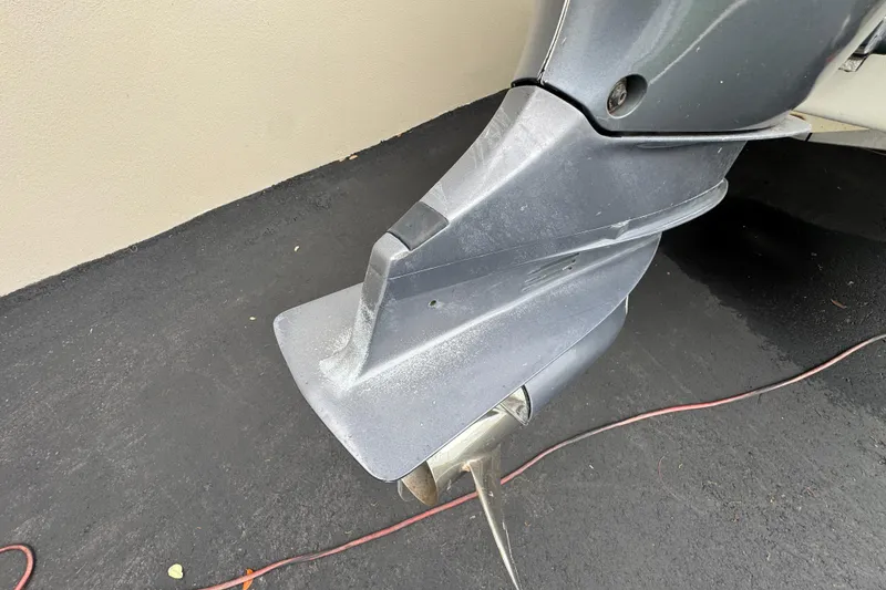 Slide: The Image of Cockpit view of a 2015 Concept 27 boat with steering wheel and control panel. - 86