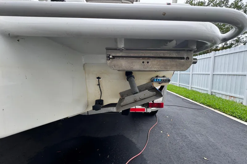 Slide: The Image of Interior view of a 2015 Concept 27 boat, featuring steering console and seating. - 88