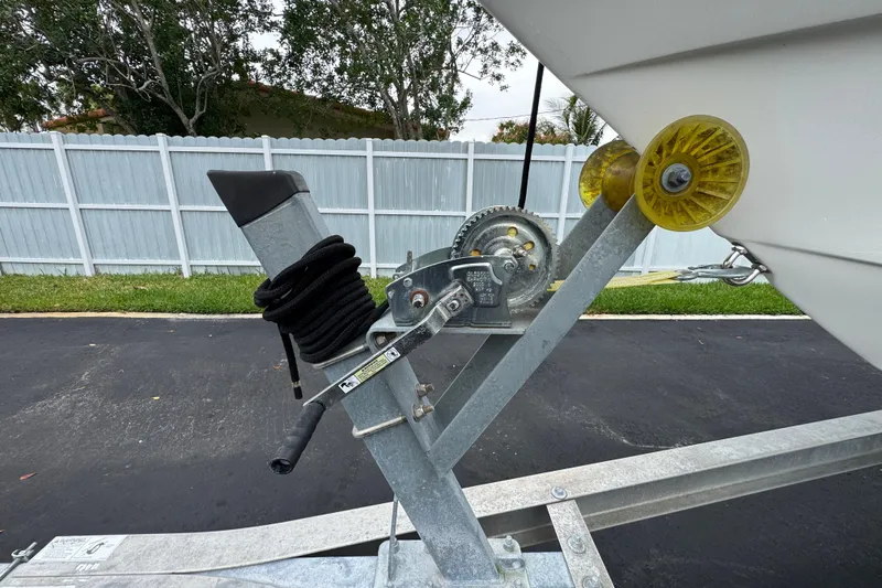 Slide: The Image of Cockpit view of a 2015 Concept 27 boat with steering wheel and control panel. - 94