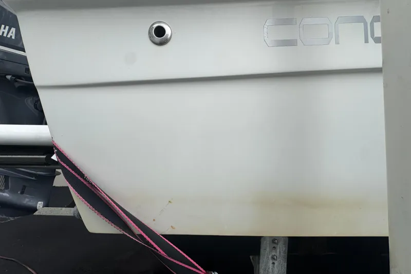 Slide: The Image of Control panel of Concept 27 boat, featuring bilge switches and audio system, 2015 model. - 98