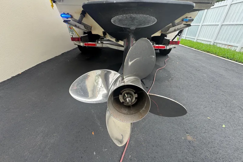 Slide: The Image of Control panel of a 2015 Concept 27 boat with labeled switches and Garmin display. - 99