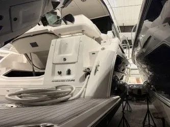Slide: The Image of 2024 Regal 38 GC yacht in a storage facility. - 10