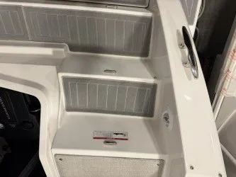 Slide: The Image of 2024 Regal 38 GC yacht displayed indoors. - 11