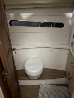 Slide: The Image of 2024 Regal 38 GC boat helm with steering wheel and controls. - 21