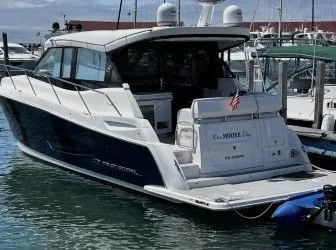 Slide: The Image of 2024 Regal 38 GC boat parked indoors. - 3