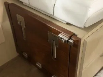 Slide: The Image of Regal 38 GC 2024 control panel with switches and gauges. - 34