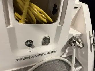 Slide: The Image of 2024 Regal 38 GC yacht in warehouse, side view. - 5