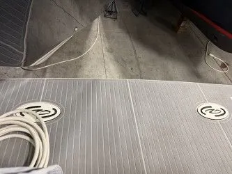 Slide: The Image of Rear view of a 2024 Regal 38 GC boat in dry dock. - 7