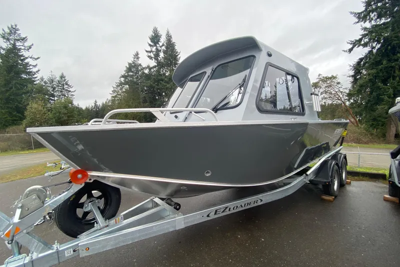 Slide: The Image of 2026 Hewescraft 200 ProV Hard Top boat on trailer, parked outdoors. - 4
