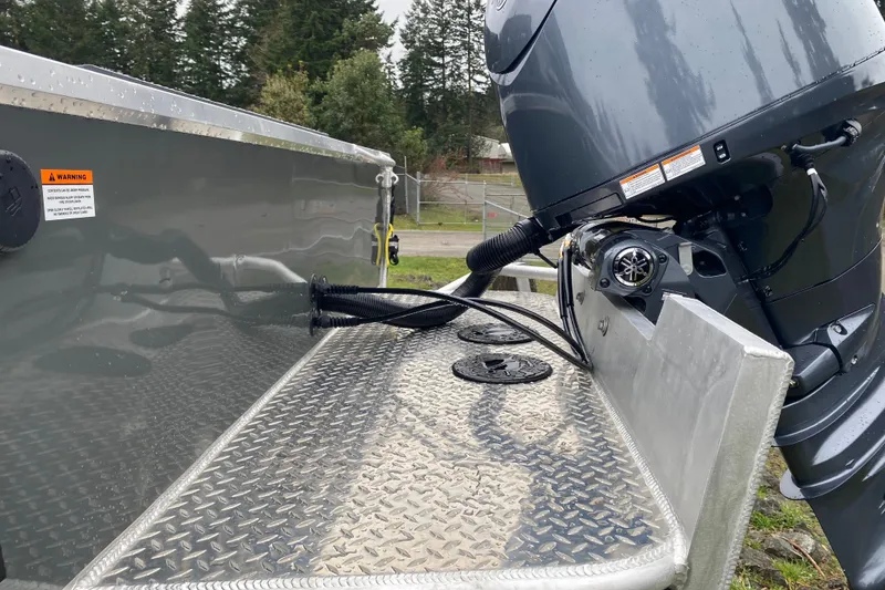 Slide: The Image of 2026 Hewescraft 200 ProV Hard Top boat with outboard motor and diamond plate deck. - 6