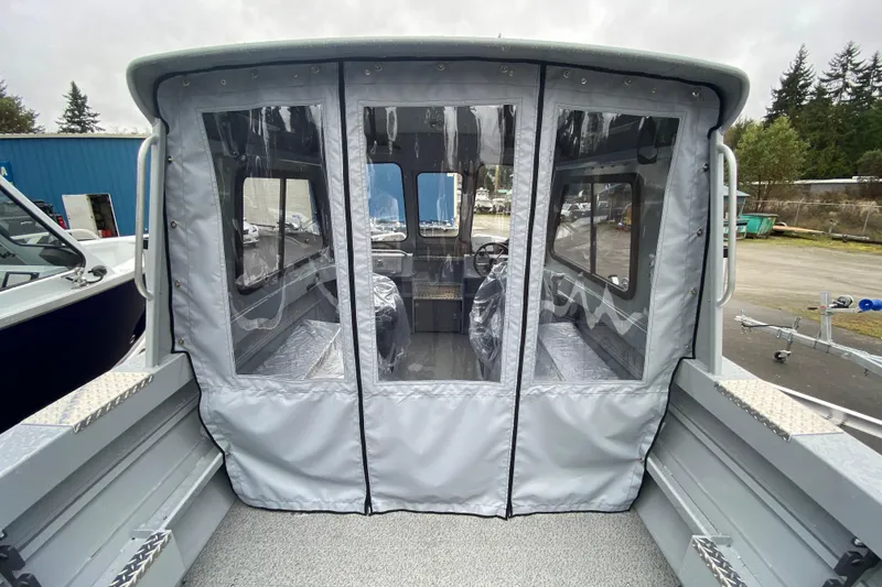 Slide: The Image of 2026 Hewescraft 200 ProV Hard Top boat interior with protective covering. - 9