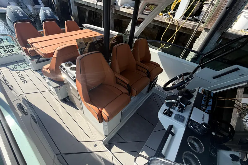 Slide: The Image of 2024 Saxdor 320 GTO boat interior with leather seating and modern controls. - 17