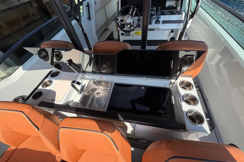 Slide: The Image of 2024 Saxdor 320 GTO boat interior with modern kitchen and seating area. - 20