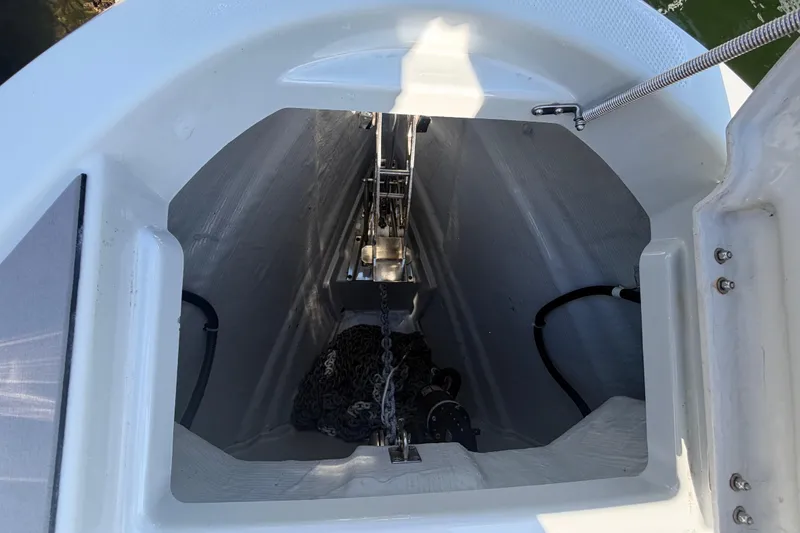 Slide: The Image of Anchor compartment of 2024 Saxdor 320 GTO boat, featuring chain and rope storage. - 31