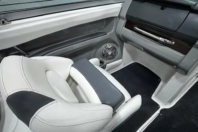 Slide: The Image of Interior of 2013 Chaparral 226 SSi boat featuring sleek seating and modern dashboard design. - 17