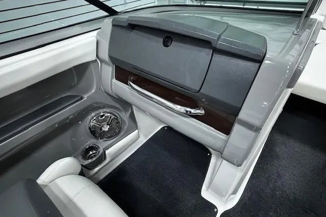 Slide: The Image of Interior of 2013 Chaparral 226 SSi boat featuring dashboard and seating area. - 18