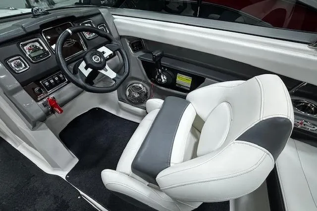 Slide: The Image of Cockpit of 2013 Chaparral 226 SSi boat with modern steering and controls. - 19