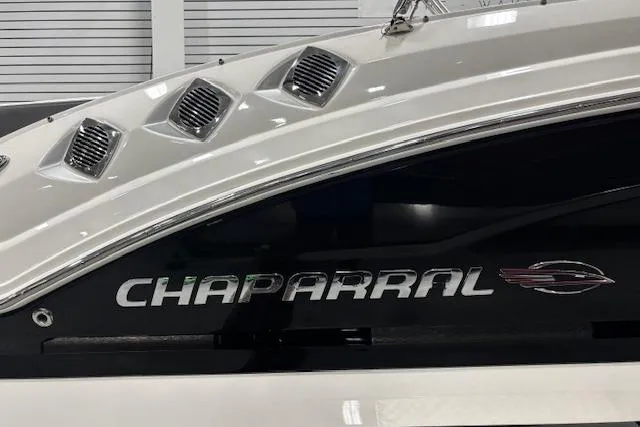 Slide: The Image of 2013 Chaparral 226 SSi boat with sleek design and distinctive branding. - 24