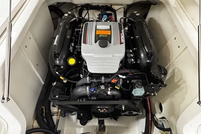 Slide: The Image of Engine compartment of a 2013 Chaparral 226 SSi boat, featuring a powerful inboard motor. - 25