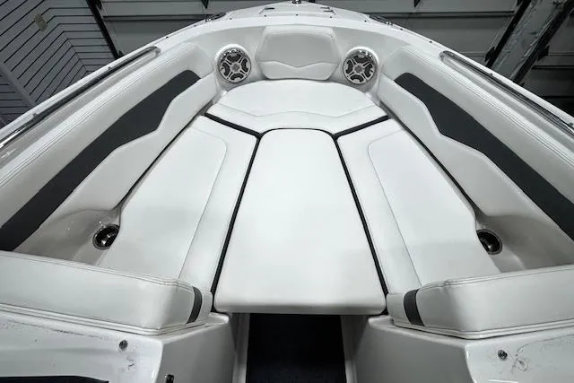 Slide: The Image of Interior view of 2013 Chaparral 226 SSi boat, featuring sleek white seating and modern design. - 34