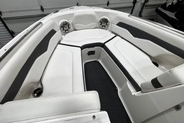 Slide: The Image of 2013 Chaparral 226 SSi boat interior with white seating and black accents. - 35