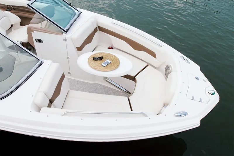 Slide: The Image of Manufacturer Provided Image: 2013 Chaparral 226 SSi boat interior with seating and table on water. - 4