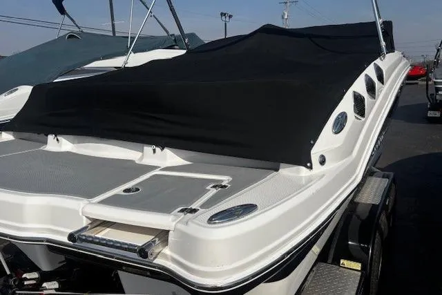 Slide: The Image of 2013 Chaparral 226 SSi boat with black cover on trailer, rear view. - 42