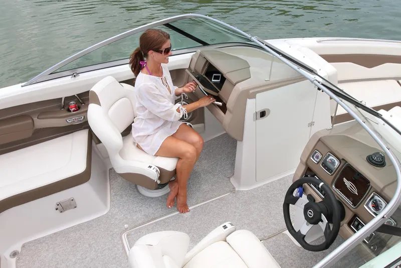 Slide: The Image of Manufacturer Provided Image: Woman operating 2013 Chaparral 226 SSi boat on water. - 7
