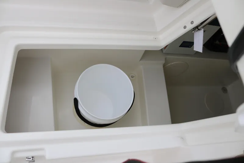Slide: The Image of Storage compartment with bucket in 2024 World Cat 280 DC-X boat. - 10