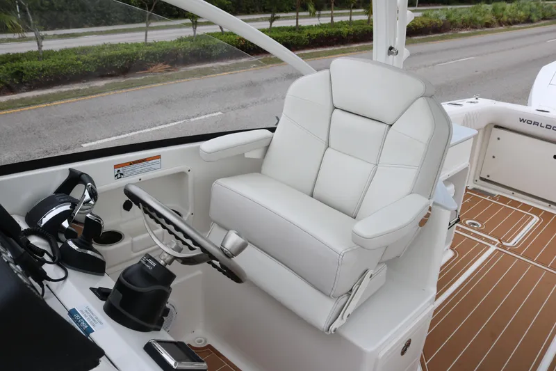 Slide: The Image of 2024 World Cat 280 DC-X helm with white captain's chair and steering wheel. - 12