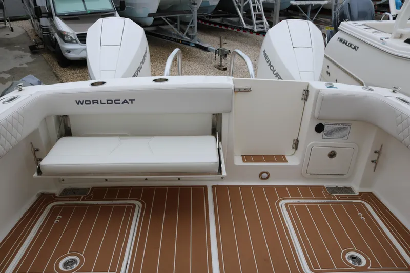 Slide: The Image of 2024 World Cat 280 DC-X boat interior with seating and twin Mercury engines. - 15