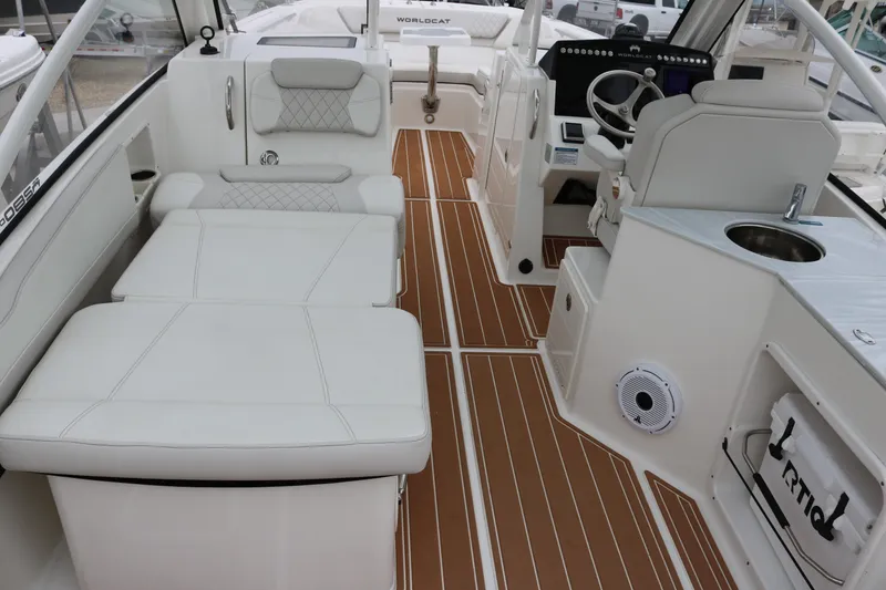 Slide: The Image of 2024 World Cat 280 DC-X interior with white seating and wood-style flooring. - 19
