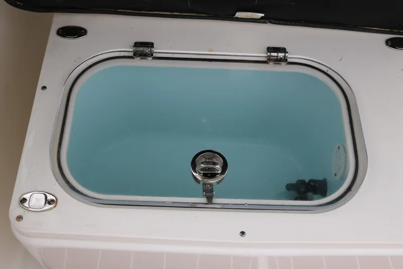 Slide: The Image of Livewell on 2024 World Cat 280 DC-X boat, featuring a clear lid and stainless steel fittings. - 20