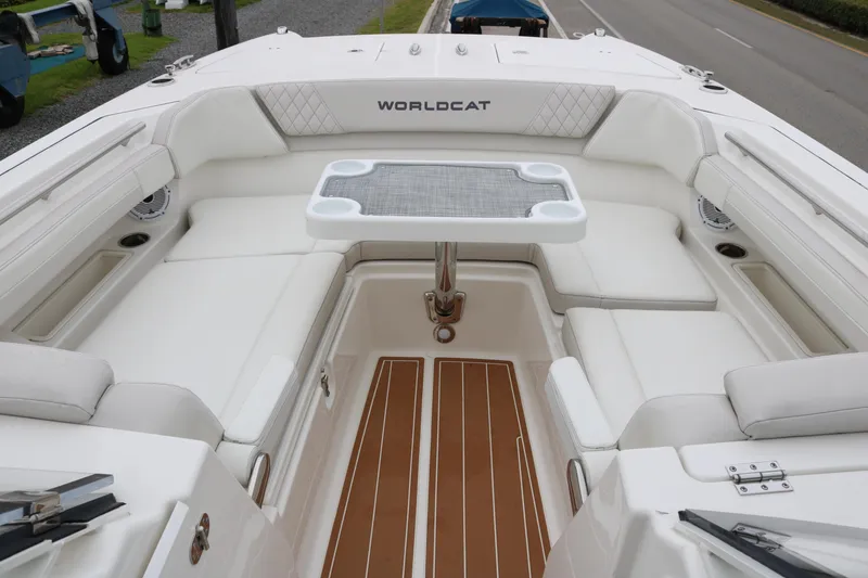 Slide: The Image of 2024 World Cat 280 DC-X boat interior with white seating and table. - 7