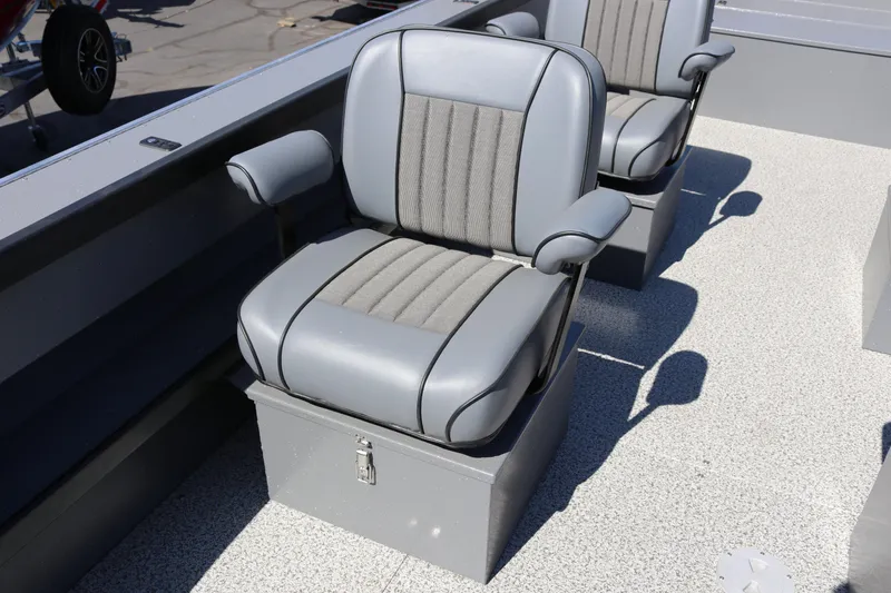 Slide: The Image of 2025 Alumaweld Columbia 23 boat seats, featuring gray upholstery and armrests. - 12