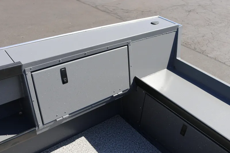 Slide: The Image of 2025 Alumaweld Columbia 23 boat interior storage compartment, featuring sleek gray design. - 19