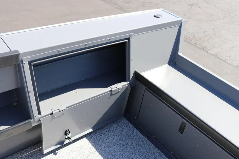 Slide: The Image of 2025 Alumaweld Columbia 23 boat storage compartment, open and empty, with durable construction. - 20