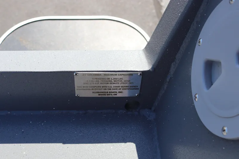 Slide: The Image of 2025 Alumaweld Columbia 23 capacity plate detailing weight and passenger limits. - 25