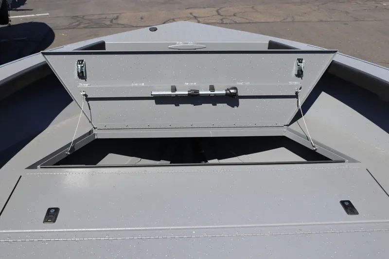 Slide: The Image of Open storage compartment on 2025 Alumaweld Columbia 23 boat deck. - 27