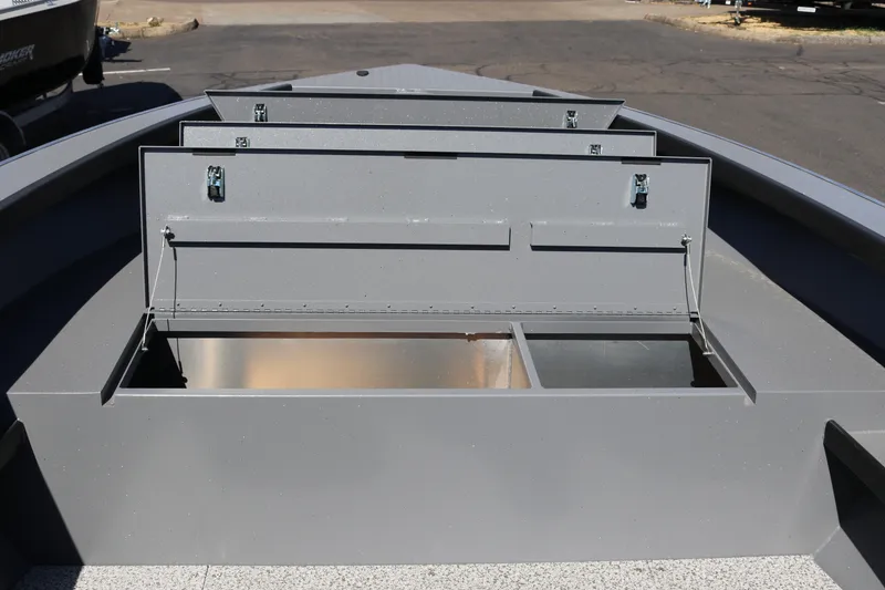 Slide: The Image of 2025 Alumaweld Columbia 23 boat storage compartments, open and empty, showcasing interior space. - 29