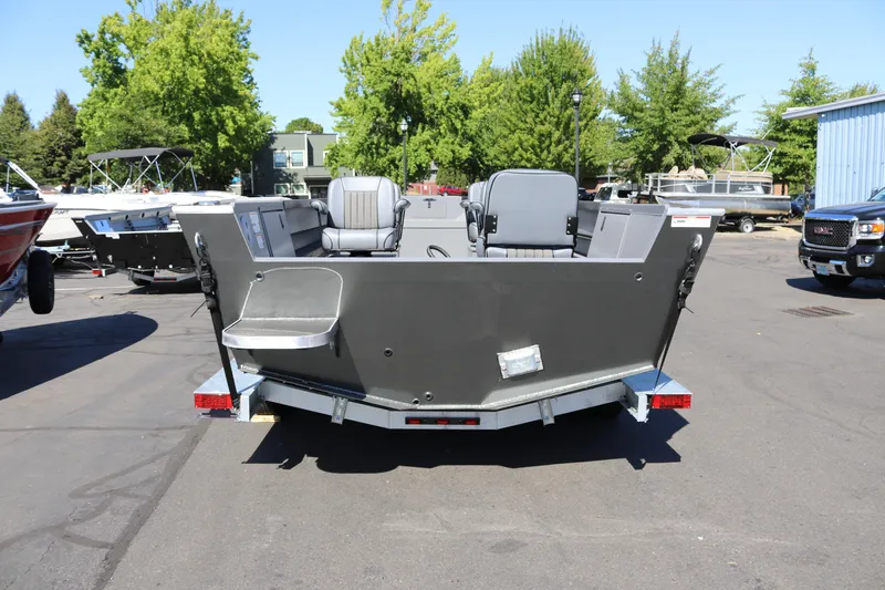 Slide: The Image of 2025 Alumaweld Columbia 23 boat on trailer, parked outdoors, rear view. - 32