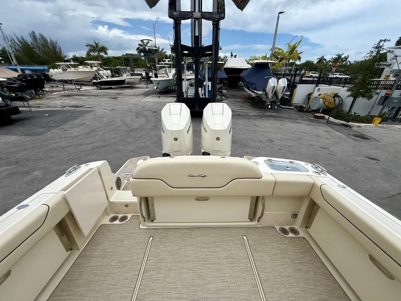Slide: The Image of Rear view of a 2026 Chris-Craft Calypso 32 boat at the dock. - 10