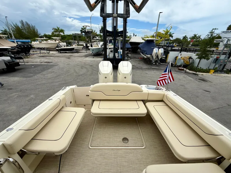Slide: The Image of Chris-Craft Calypso 32 boat, 2026 model, featuring beige interior and American flag. - 13