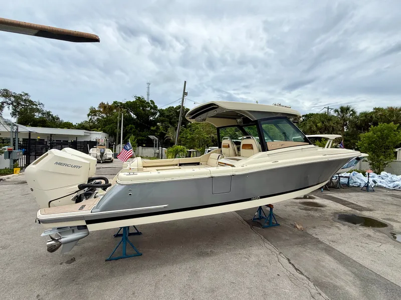 Slide: The Image of 2026 Chris-Craft Calypso 32 boat on a parking lot. - 28