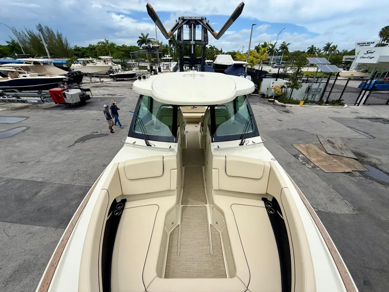 Slide: The Image of Chris-Craft Calypso 32 boat, 2026 model, parked in a marina. - 4