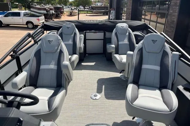 Slide: The Image of 2024 Viaggio Lago X 22 Q boat interior with four luxurious gray seats. - 3