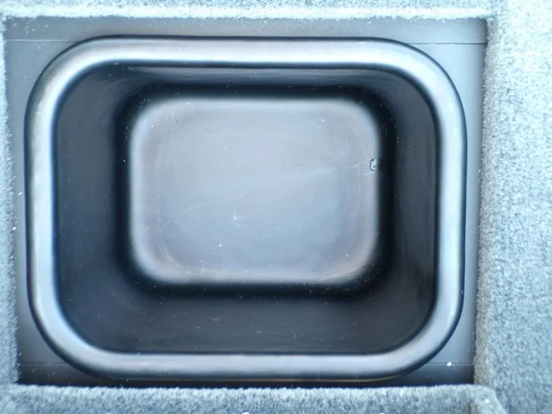 Slide: The Image of Skeeter FXR20L 2025 boat storage compartment, rectangular and lined. - 20