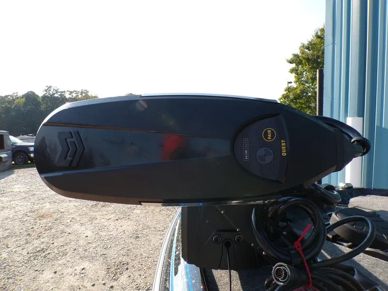 Slide: The Image of Close-up of a 2025 Skeeter FXR20L boat motor in outdoor setting. - 9