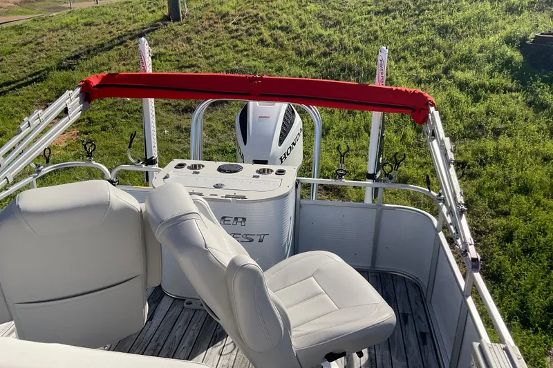 Slide: The Image of 2019 Angler Quest 826 CRAPPIE boat interior with seating and fishing rod holders. - 10
