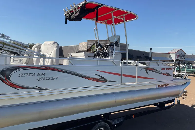 Slide: The Image of 2019 Angler Quest 826 CRAPPIE pontoon boat with red canopy and fishing rod holders. - 2